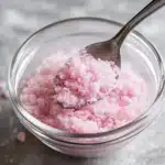 Mixing pink salt and lemon juice