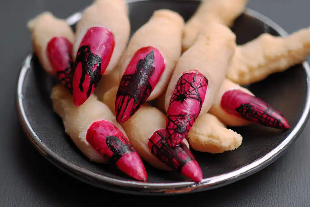 spooky Halloween fingers on dark wooden tray